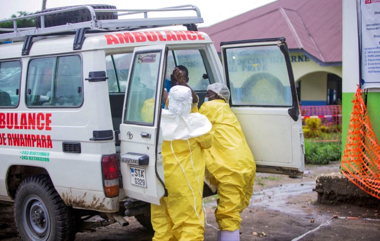 congolese-health-workers-receive-patient-1094463503.jpg
