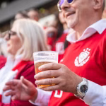 0_Senior-Caucasian-Man-Smiling-While-Enjoying-Beer-at-Soccer-Match.jpg