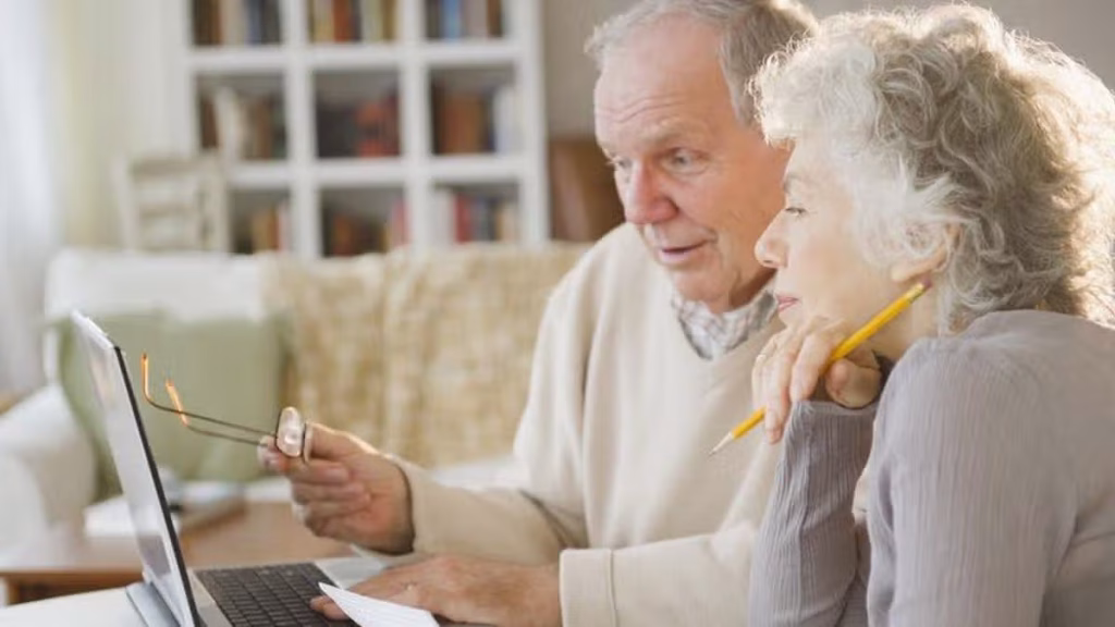 8_Senior-couple-going-over-bills-with-laptop.jpg