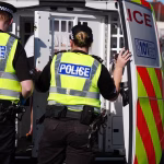 1_EMBARGOED-TO-0001-THURSDAY-SEPTEMBER-24-Police-officers-arrest-a-person-after-raiding-a-property-i.avif